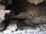 SX05803 Cave in cliffs with small bridge half way up.jpg